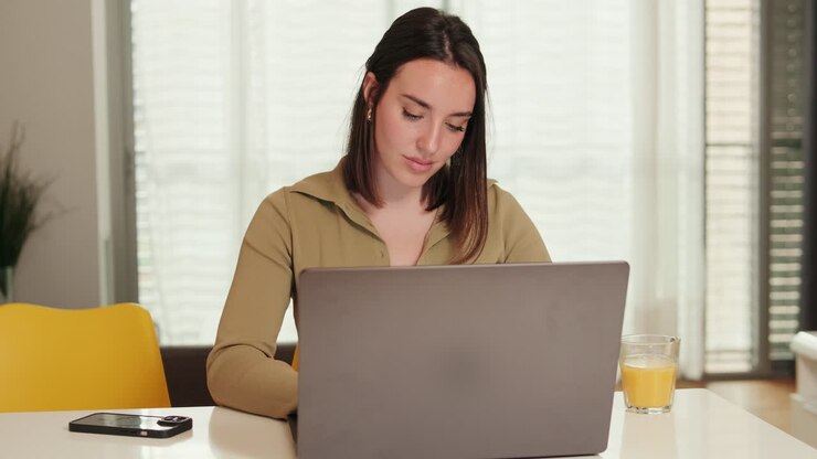 Portrait of the Woman Working From Home on Laptop