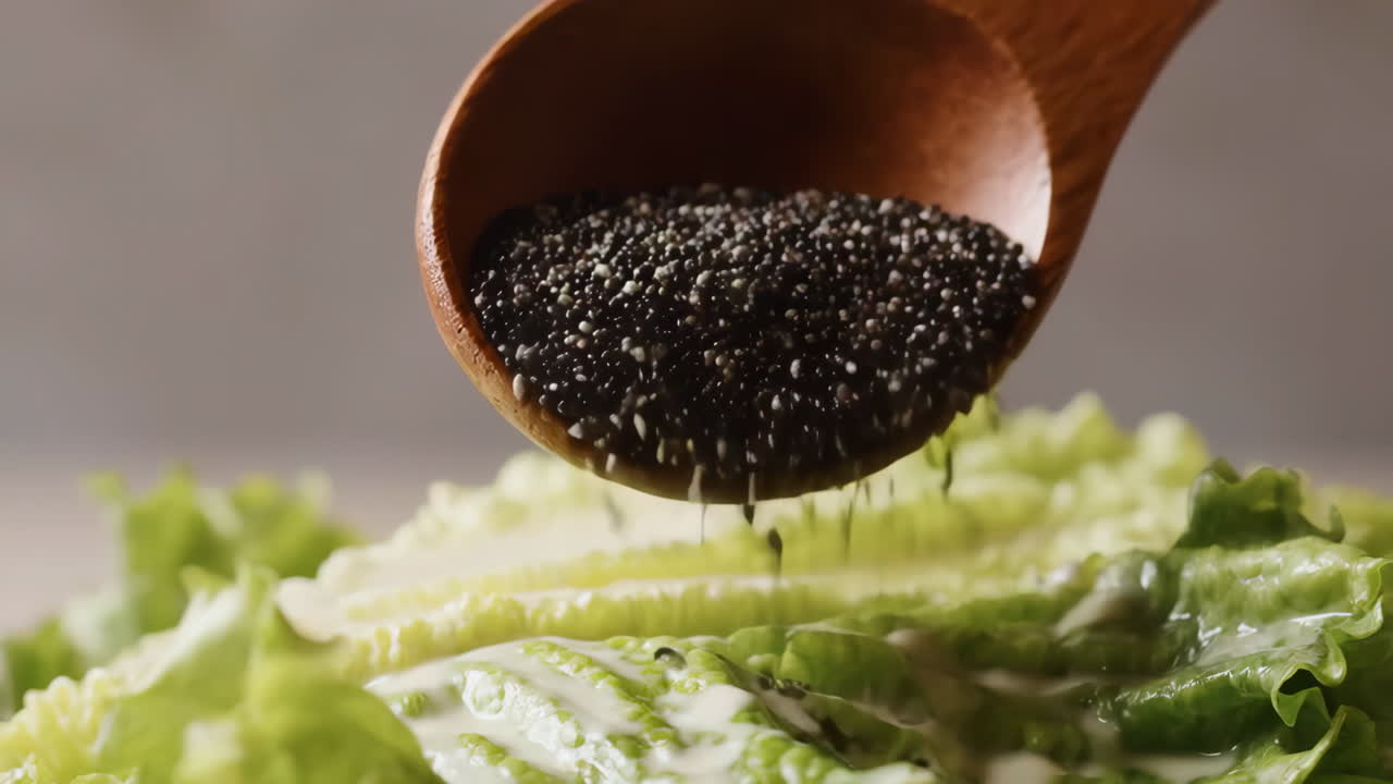 Adding chia seeds to a fresh green salad