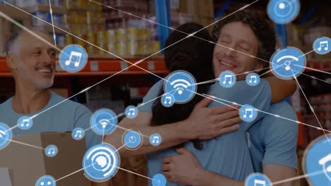 Animation-of-network-of-connections-with-icons-over-happy-diverse-warehouse-workers