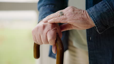 senior, cane and closeup of hands with arthritis