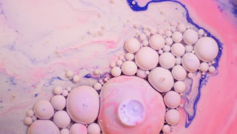 abstract fluid art with pink, purple, and white bubbles