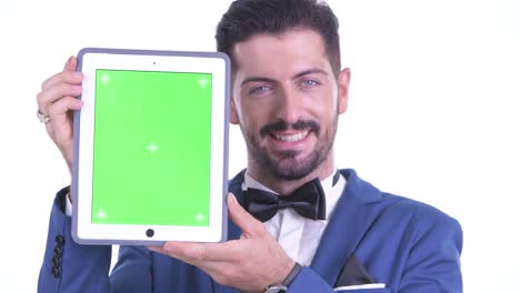 portrait of businessman holding digital tablet with copy space