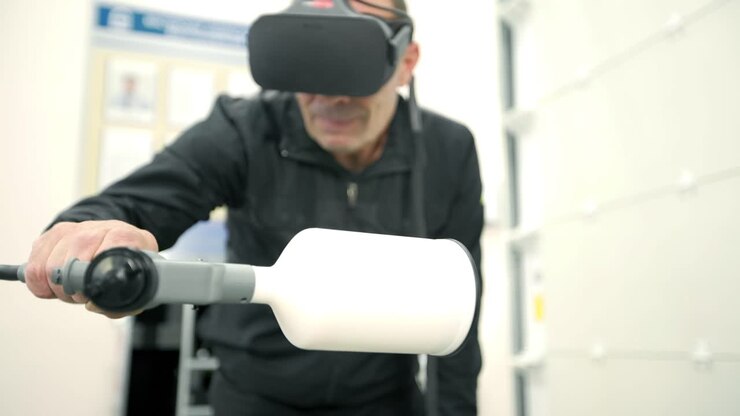 Worker using VR and Spray Painting Equipment