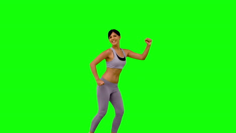 Sportliche-Frau-Springt-Und-Posiert-Auf-Greenscreen