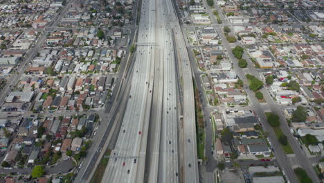 AERIAL:-Slow-Overhead-Lookup-over-110-Highway-with-little-car-traffic-in-Los-Angeles,-California-on-Cloudy-Overcast-Day