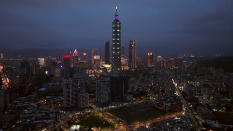 aerial panorama of lighting 101 tower in city of taipei during night, taiwan