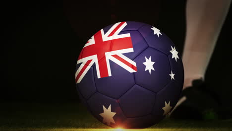 football player kicking australia flag ball