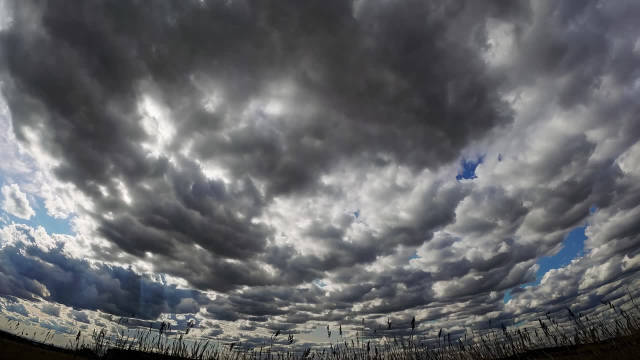Dramatic fisheye view of a cloudy sky, emphasizing depth and movement, ideal for a time-lapse video