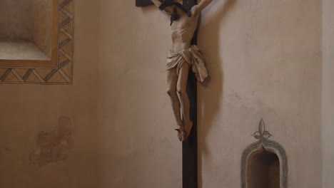 antique crucifix of jesus christ on a church wall