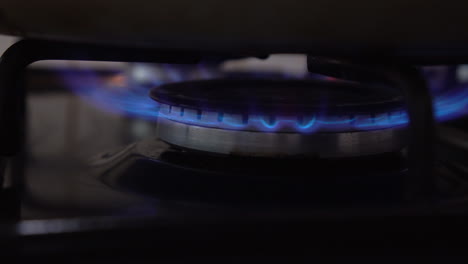 switching on a gas burner with blue flames