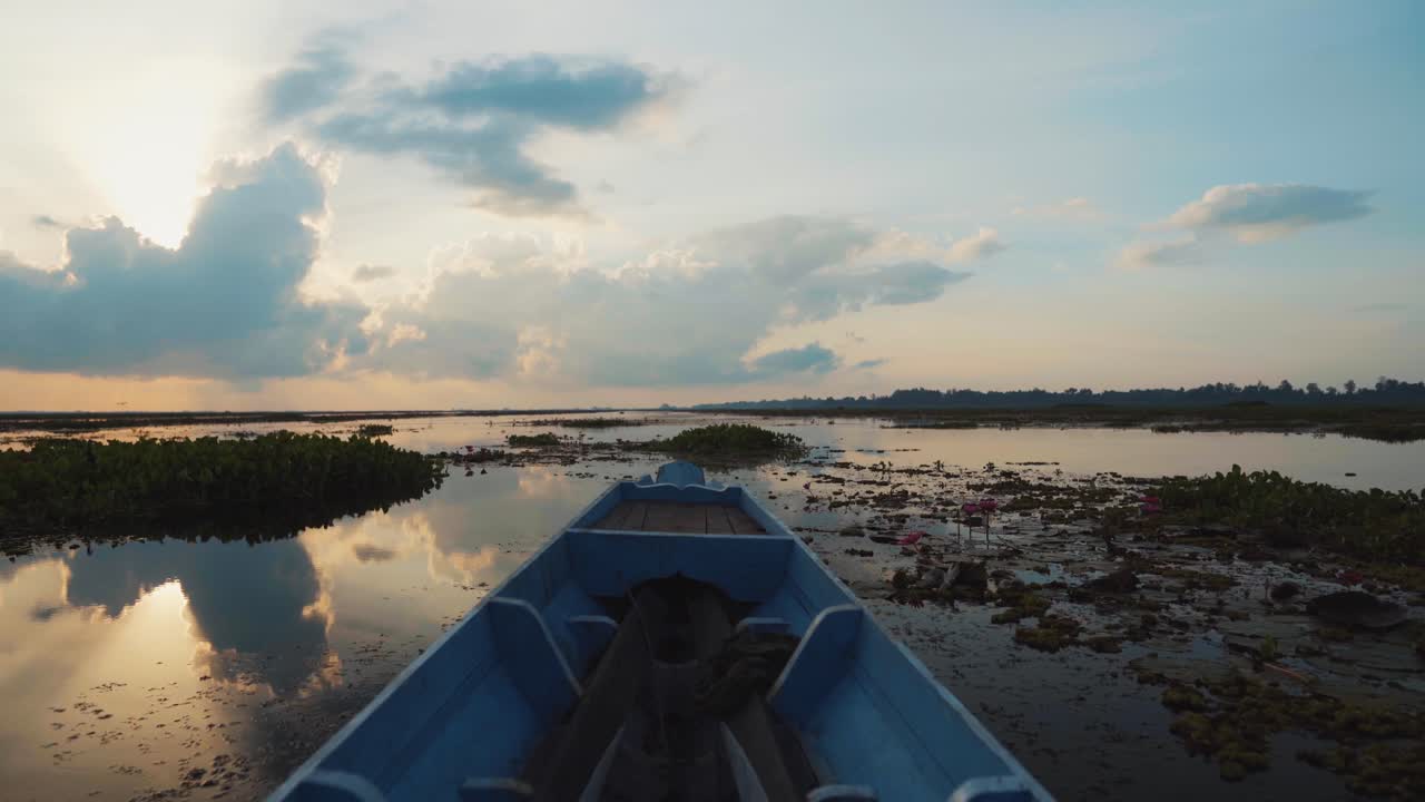 Sunrise or Sunset on a Calm Lake with a Boat