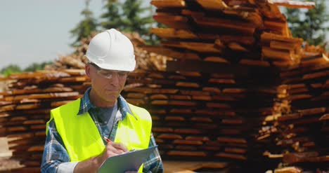 Male-Worker-Examining-Plank'S-Stack-3