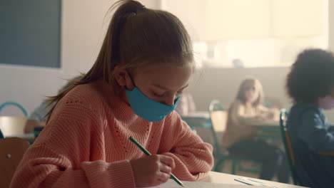 Student-in-protective-mask-studying-at-school-during-corona-virus-pandemic