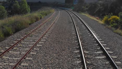 train tracks winding through countryside