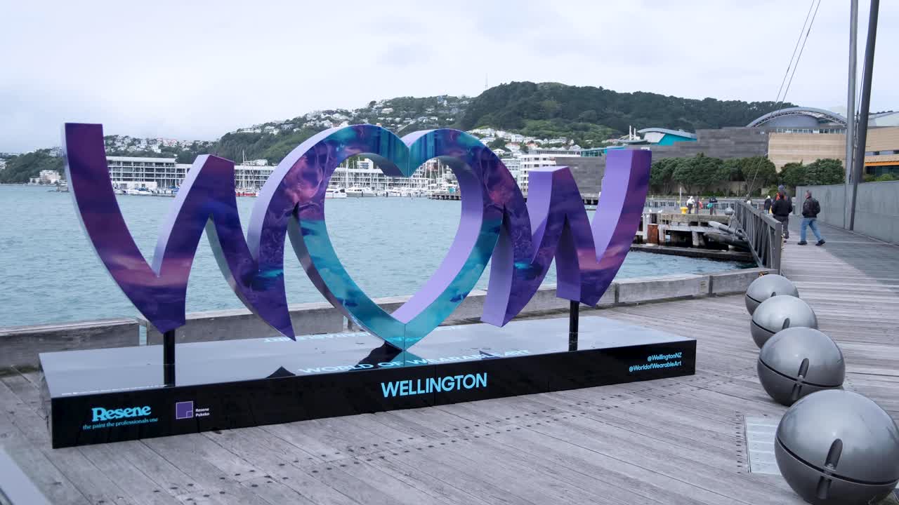 WOW sign on waterfront for World of WearableArt 2024 event in capital city of Wellington, New Zealand Aotearoa