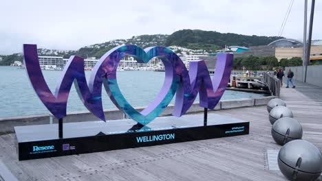 wow sign on waterfront for world of wearableart 2024 event in capital city of wellington, new zealand aotearoa