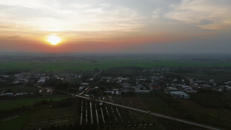 Sunset over Rural Village and Farmland