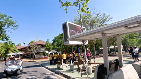 golf carts transporting visitors through zoo entrance