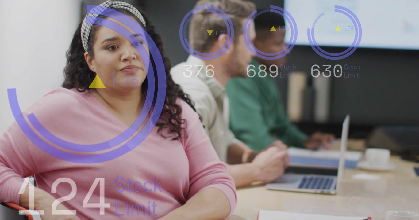 Woman in pink gesturing, initiating purple HUD and numeric readouts while presenting business data