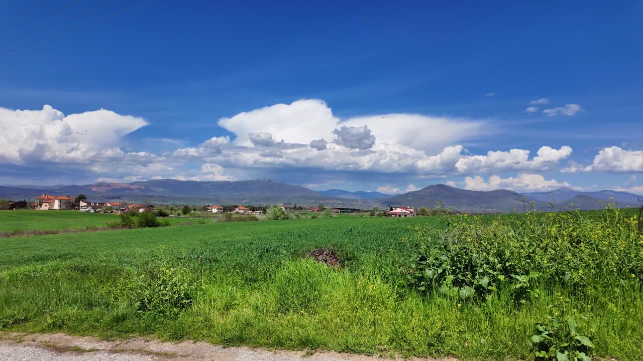 Greek village nature filed rural countryside landscape blue skyline with clouds
