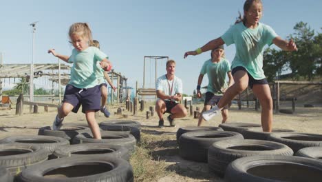 group of caucasian children training at boot camp