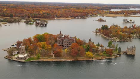 castle on an island with colorful autumn trees on it in new york state