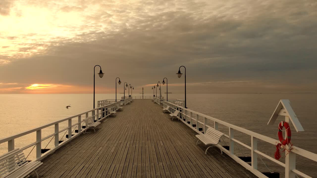 hermoso paseo suave de un muelle de madera hacia el mar báltico y el amanecer en el horizonte, gdynia, polonia