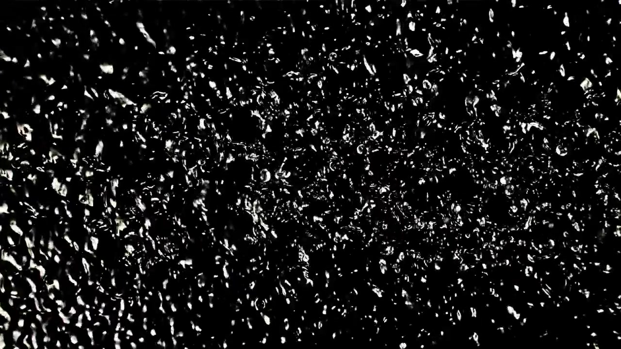 Bolle liquide astratte che si muovono su uno sfondo scuro.