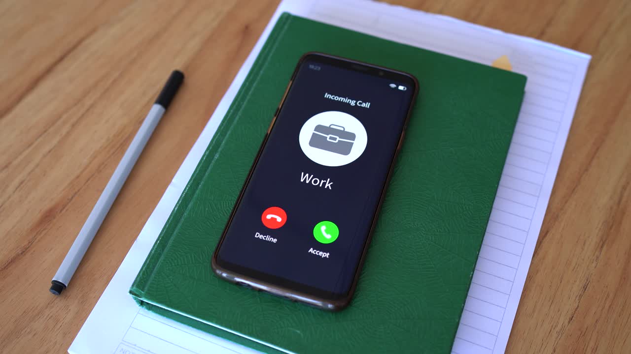 Incoming call from work. Concept of getting called from your manager off the work hours.