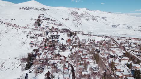 aerial view of ski resort village of farellones on snowy mountains in lo barnechea, chile