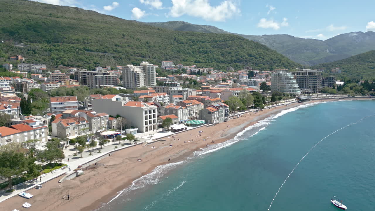 Coastal Town with Beach and Mountain Scenery