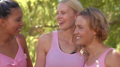 in high quality format smiling women in pink for breast cancer awareness