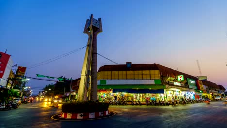 day to night timelapse of khonburi clock tower. it is landmark in center downtown of khonburi district, nakhon ratchasima, thailand