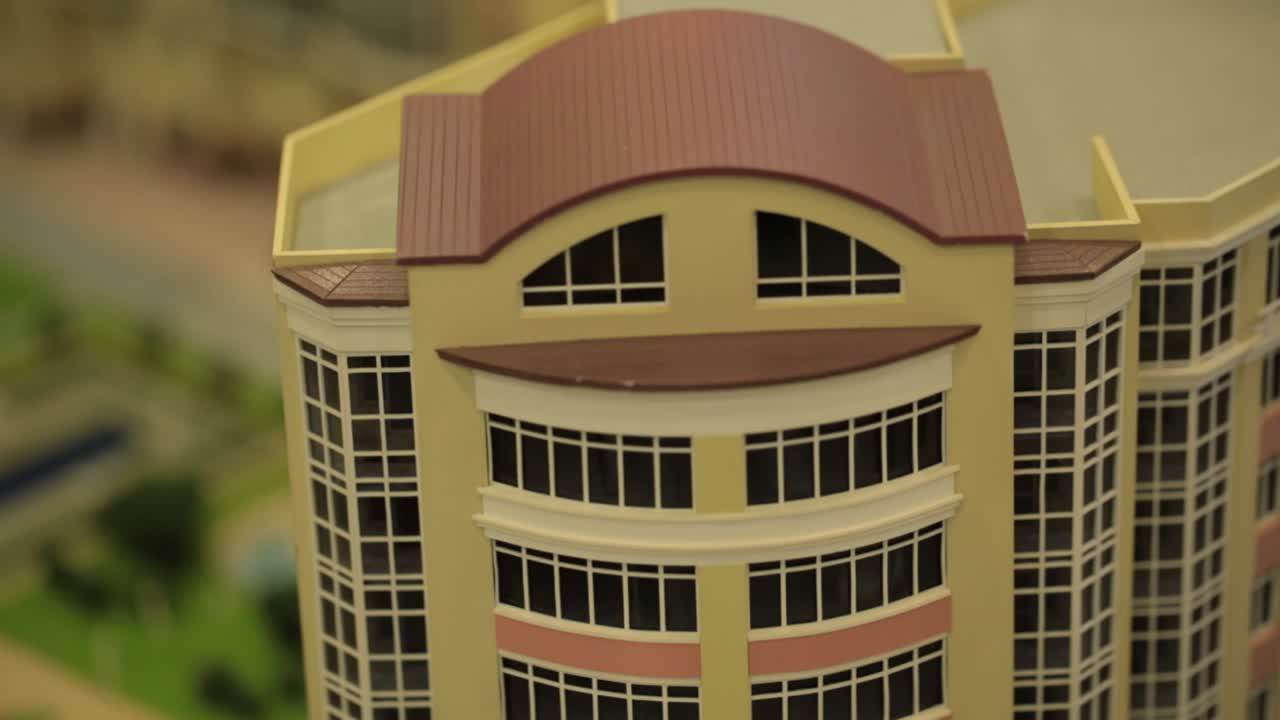 Maqueta de complejo residencial con parque y piscina