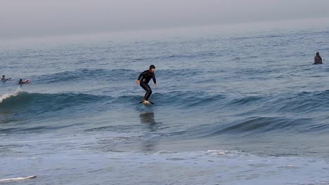 Foil-Surfer-Surfing-Ocean-Waves-Slow-Motion