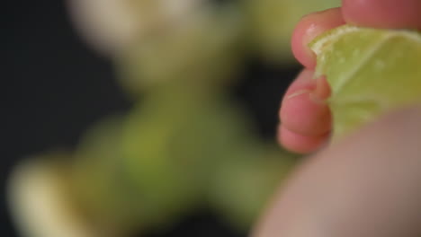 squeezing juicy lime in slow motion