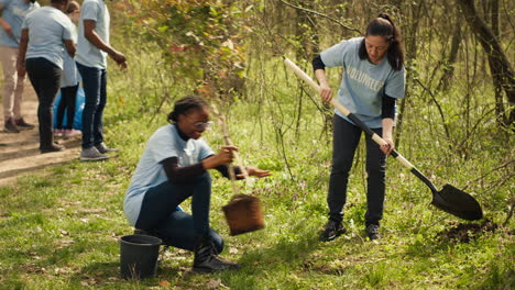 team of climate change activists doing voluntary work to plant trees