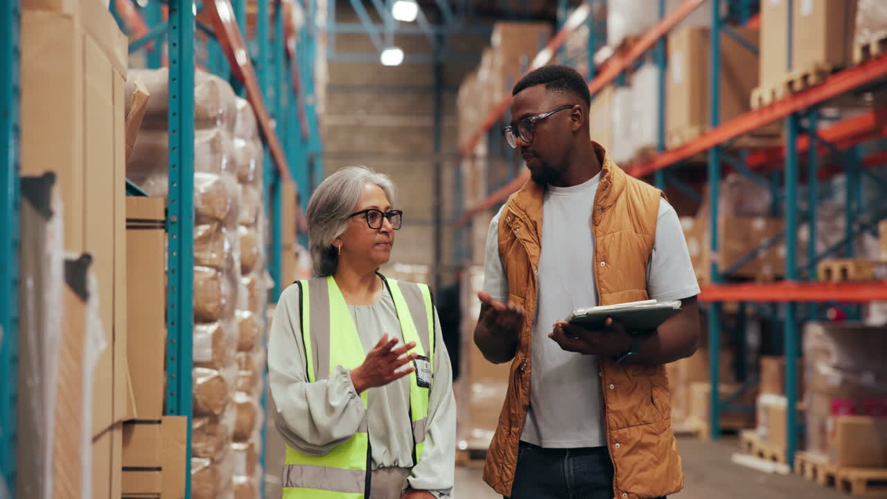 Diverse Warehouse Workers Discussing Inventory and Logistics