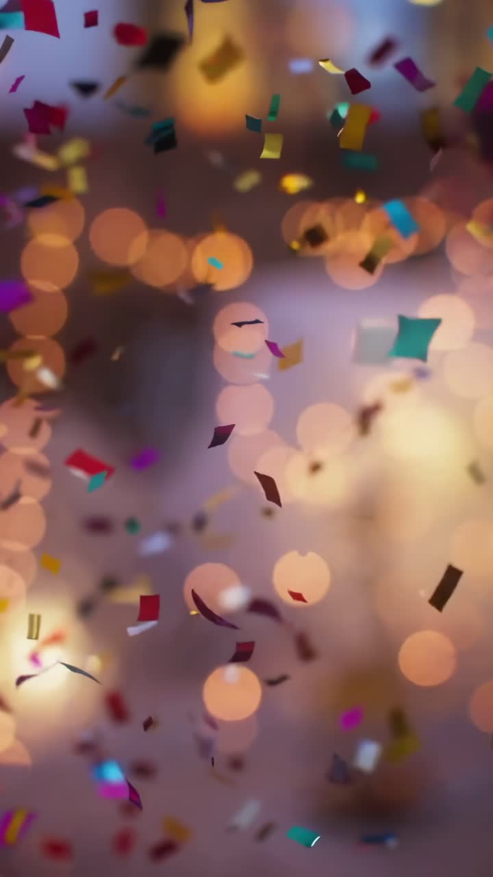 Confeti vibrante cayendo en cámara lenta, capturado desde un ángulo bajo, perfecto para un video festivo