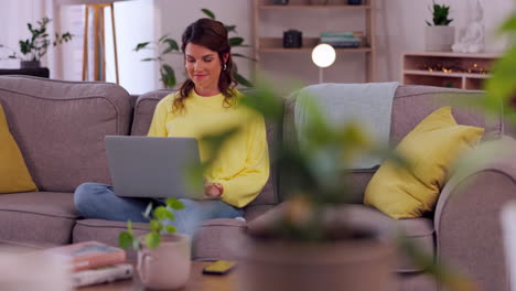 Laptop,-home-and-woman-on-sofa-for-remote-work