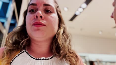 candid moment in a busy clothing shop