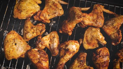 delicious chicken pieces frying on barbecue grill