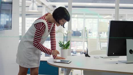 animation of data processing over asian businesswoman in office