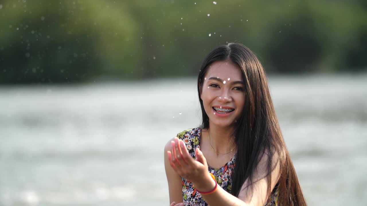 Smiling Woman by a River