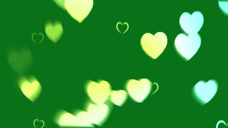 abstract green background with blurry hearts