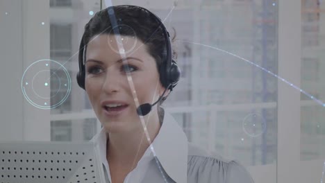 Animation-of-networks-of-connections-over-businesswoman-using-phone-headsets