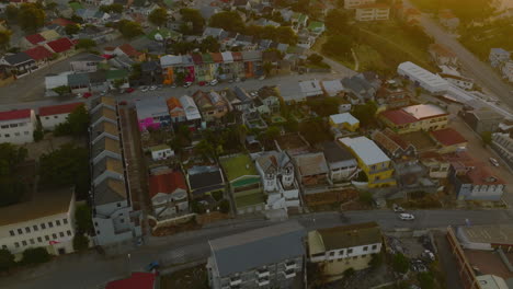 Aerial-footage-of-residential-houses-along-streets-in-urban-neighbourhood-at-dusk.-Port-Elisabeth,-South-Africa