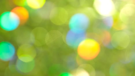 a beautiful green background rotates in a circle a beautiful green background rotates in a circle video with shimmering round sparkles beautiful bokeh new year and christmas concept video