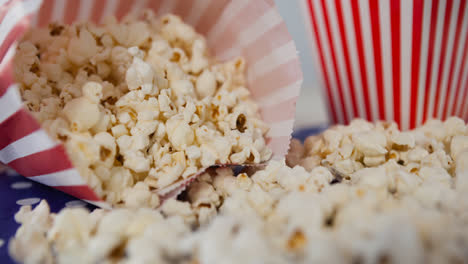 Animation-of-box-of-popcorn-over-red-and-white-box