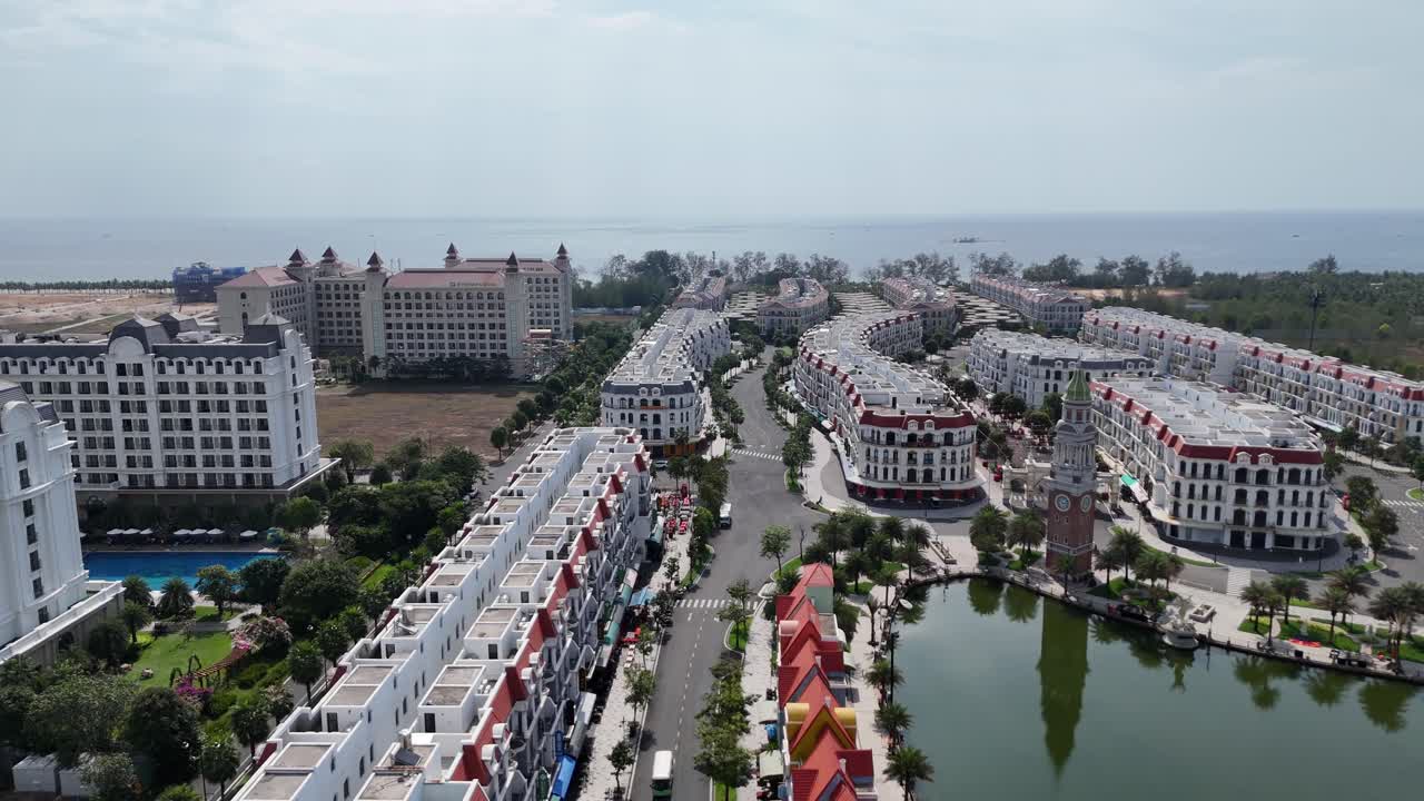 Drone footage showing an upcoming tourist destination in Phu Quoc Island, Vietnam planned community with a unique aesthetic architecture. Less crowded due to economic slowdown and recession.